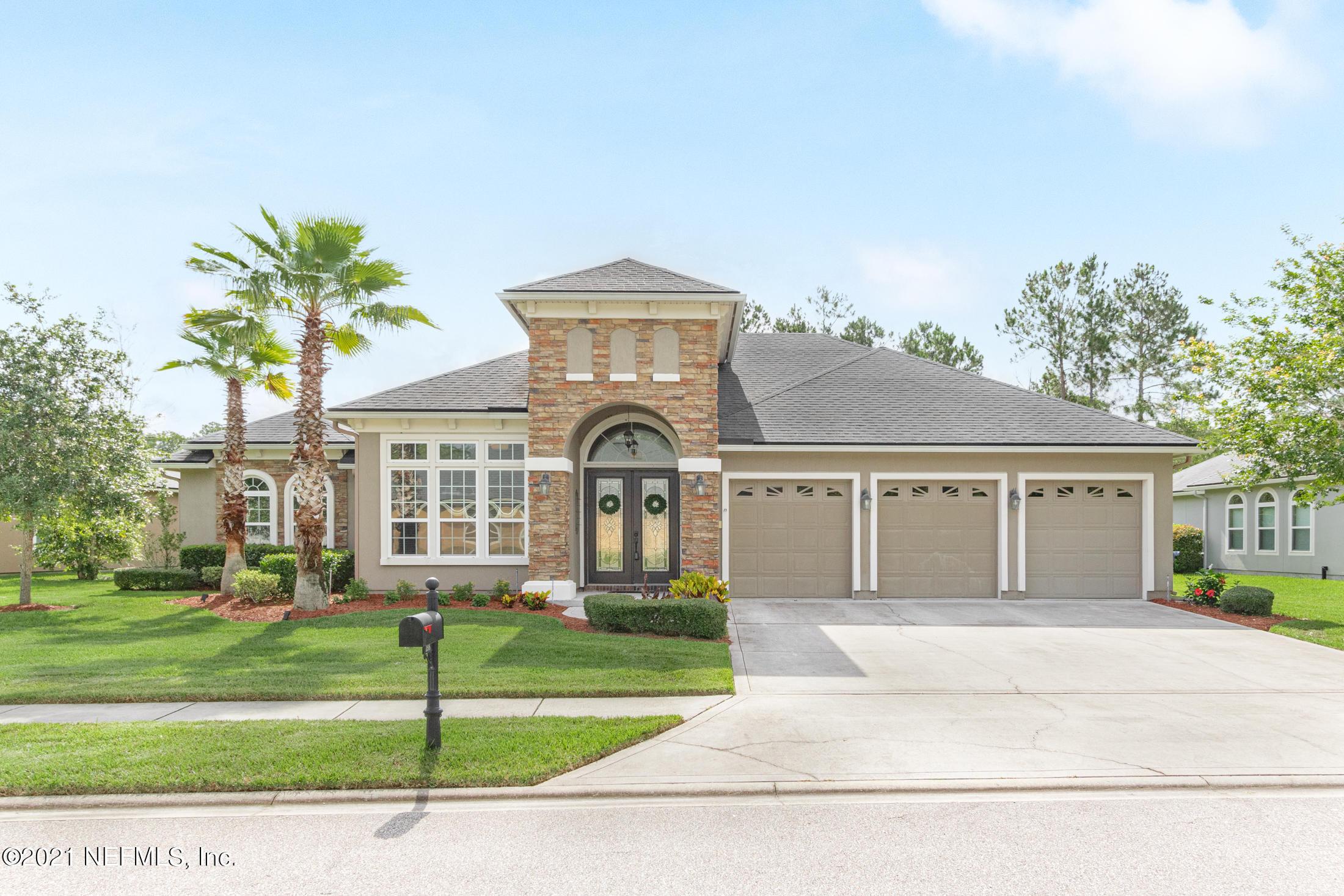 198 Glen Laurel Drive St. Johns, FL 32259 - Photo 1 of 51 a front view of a house with a garden and trees
