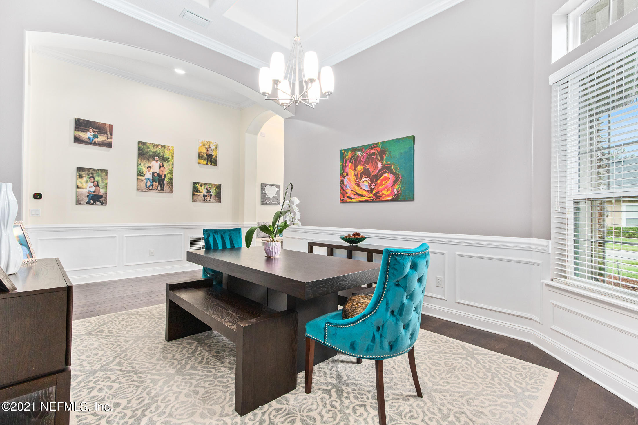 198 Glen Laurel Drive St. Johns, FL 32259 - Photo 11 of 51 a view of a dining room with furniture a chandelier and wooden floor