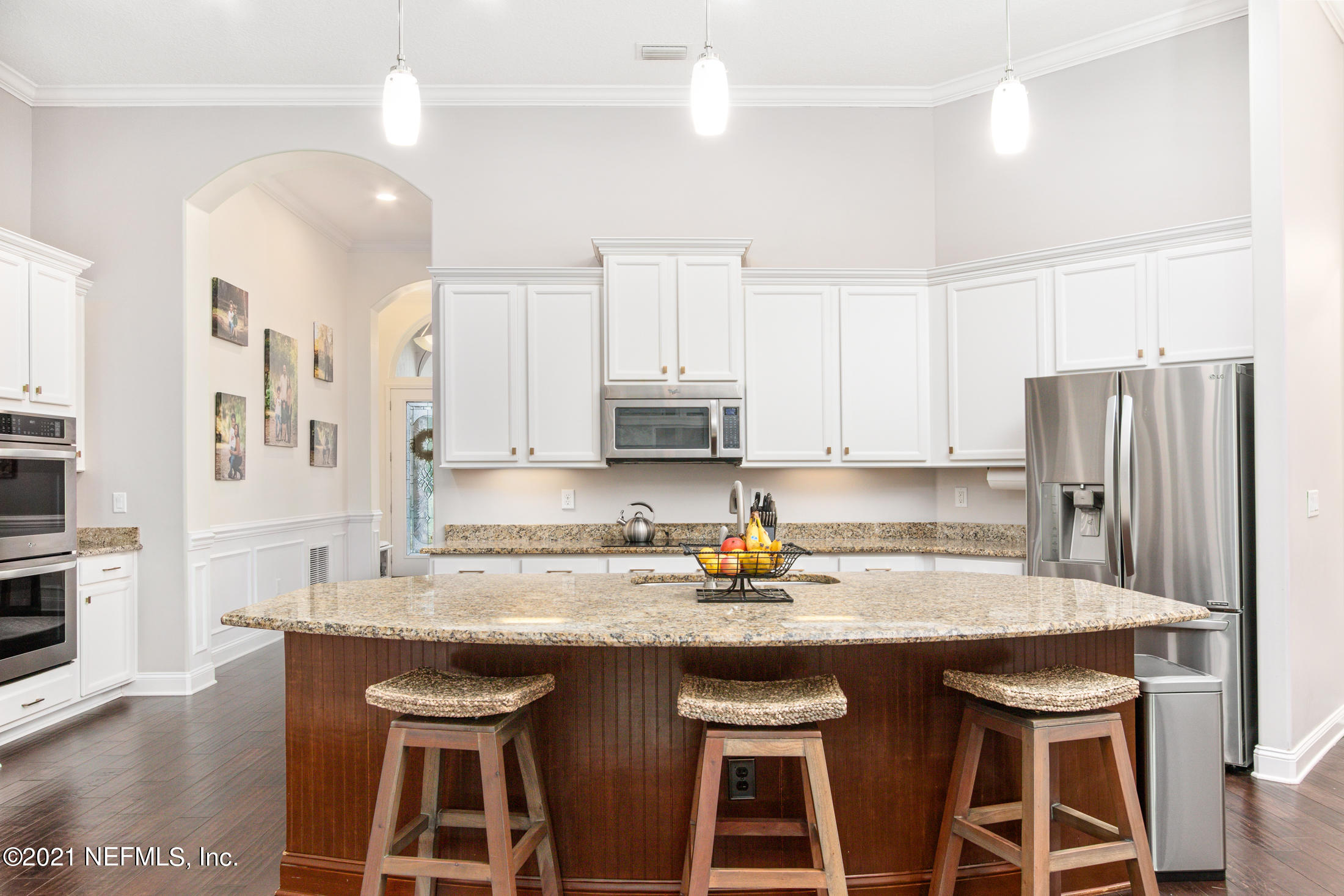 198 Glen Laurel Drive St. Johns, FL 32259 - Photo 13 of 51 a kitchen with stainless steel appliances granite countertop a table chairs sink refrigerator and cabinets