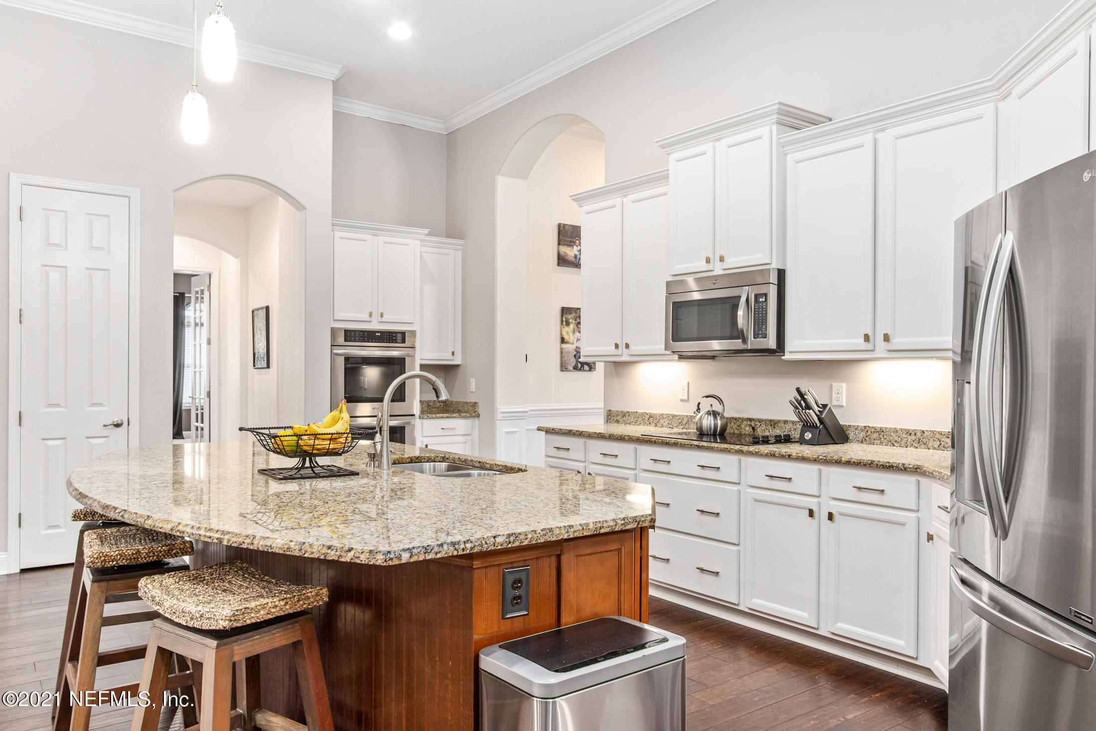 198 Glen Laurel Drive St. Johns, FL 32259 - Photo 15 of 51 a kitchen with stainless steel appliances granite countertop a kitchen island a stove cabinets a sink and a refrigerator