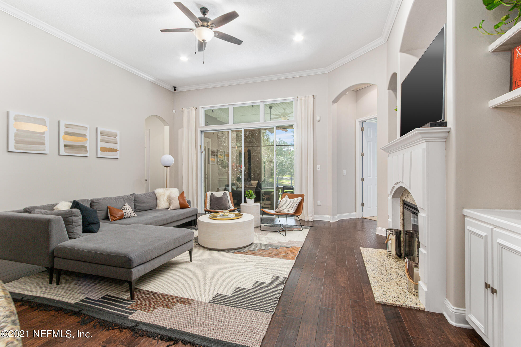 198 Glen Laurel Drive St. Johns, FL 32259 - Photo 18 of 51 a living room with furniture and a fireplace
