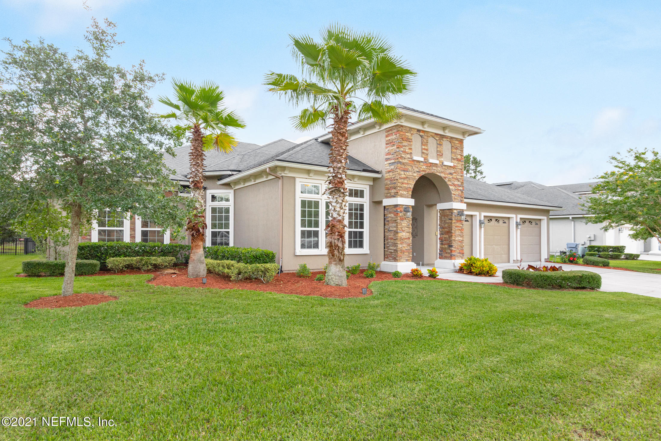 198 Glen Laurel Drive St. Johns, FL 32259 - Photo 2 of 51 a front view of a house with a yard and garage