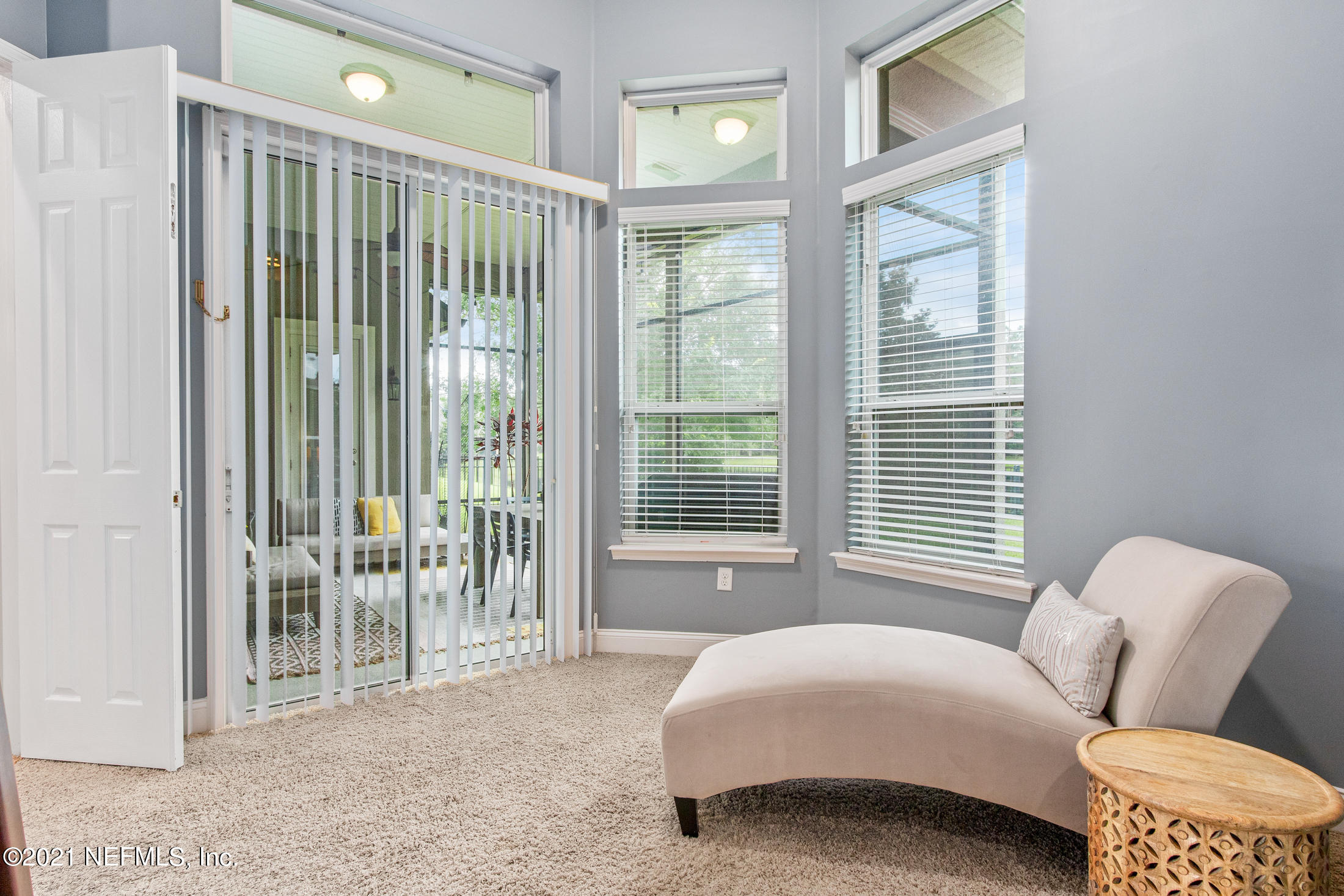 198 Glen Laurel Drive St. Johns, FL 32259 - Photo 22 of 51 a bedroom with a bed and glass door