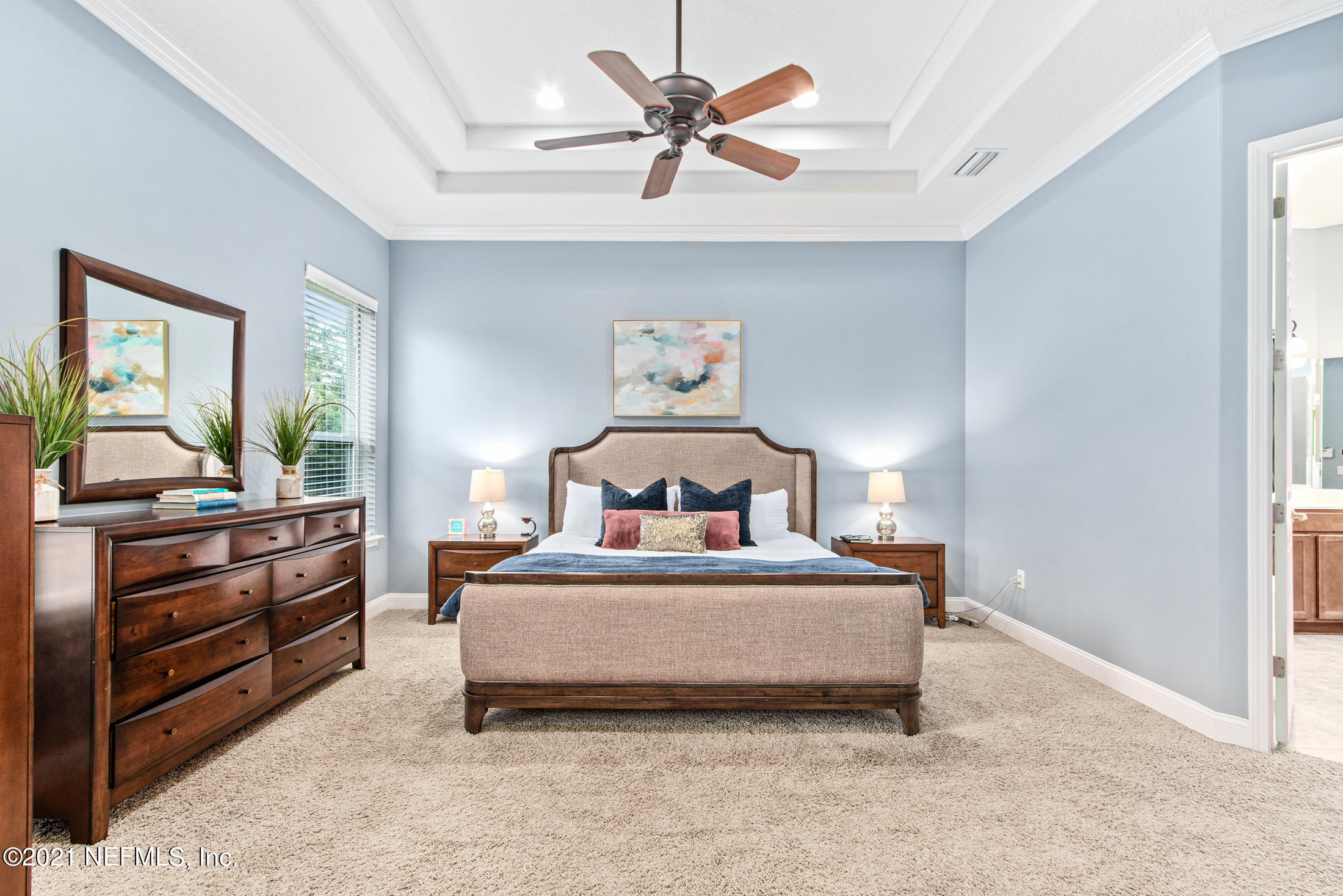 198 Glen Laurel Drive St. Johns, FL 32259 - Photo 23 of 51 a bedroom with a bed and a chandelier