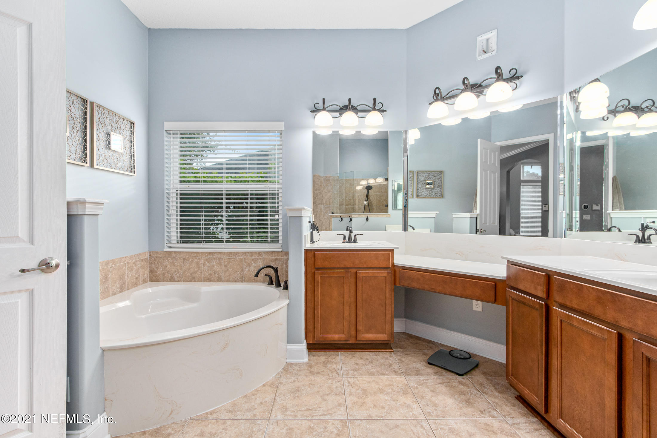 198 Glen Laurel Drive St. Johns, FL 32259 - Photo 27 of 51 a spacious bathroom with a tub double sink and mirror