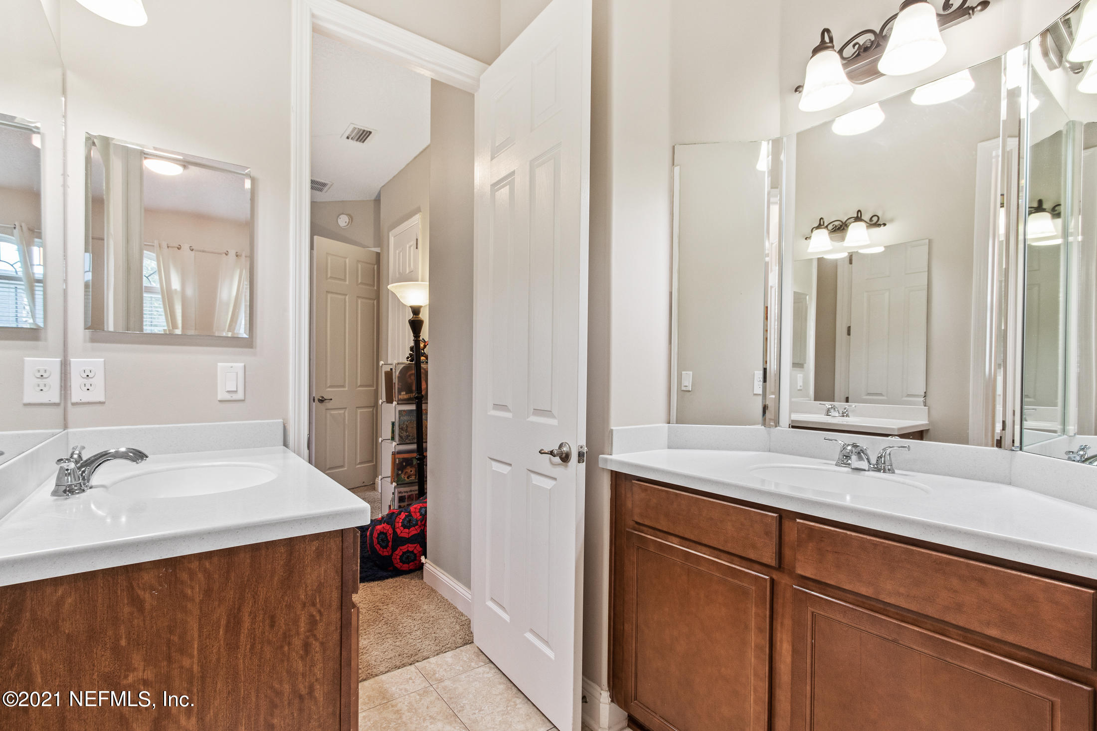 198 Glen Laurel Drive St. Johns, FL 32259 - Photo 31 of 51 a bathroom with a sink double vanity and a mirror