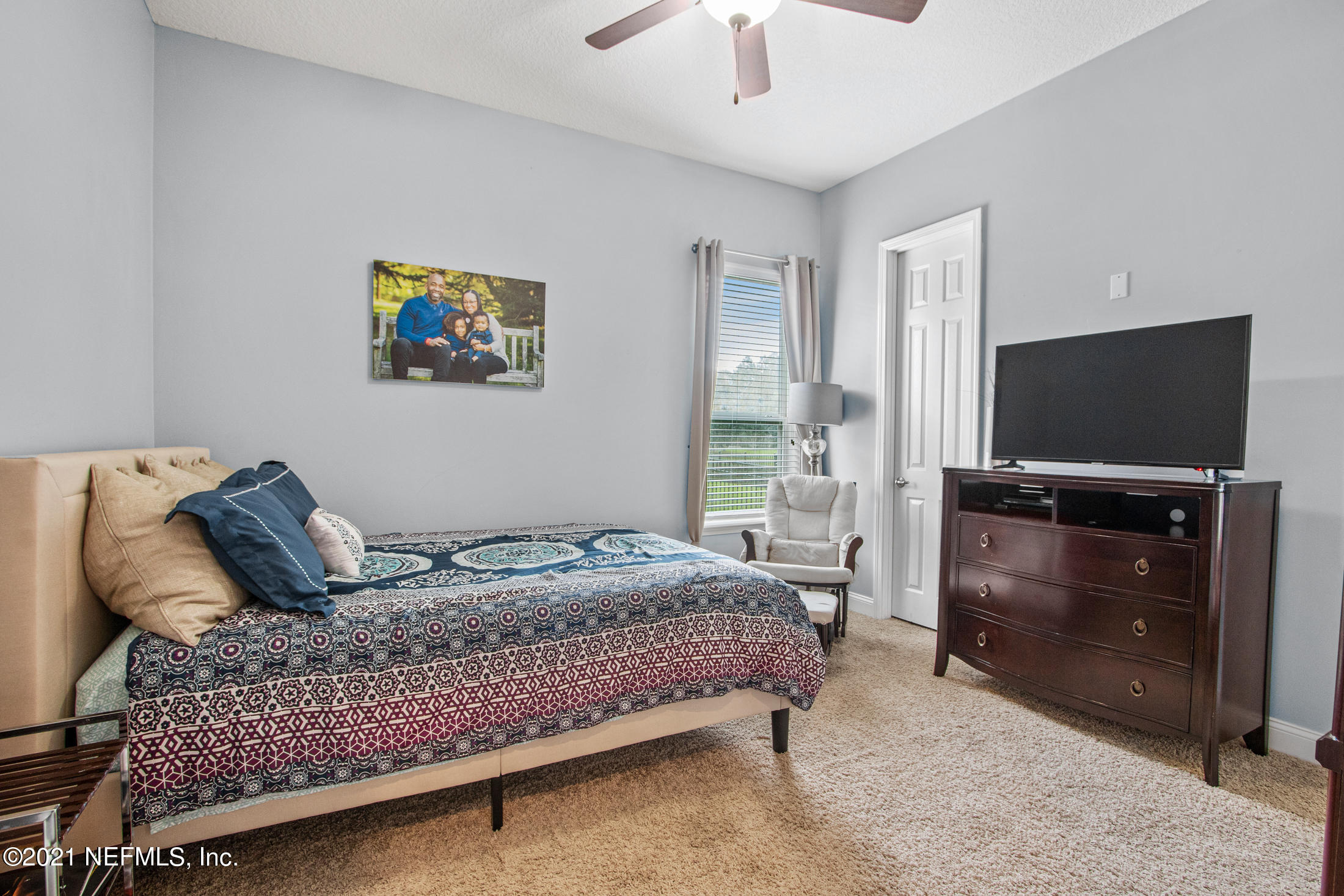 198 Glen Laurel Drive St. Johns, FL 32259 - Photo 33 of 51 a bedroom with a bed and a flat screen tv