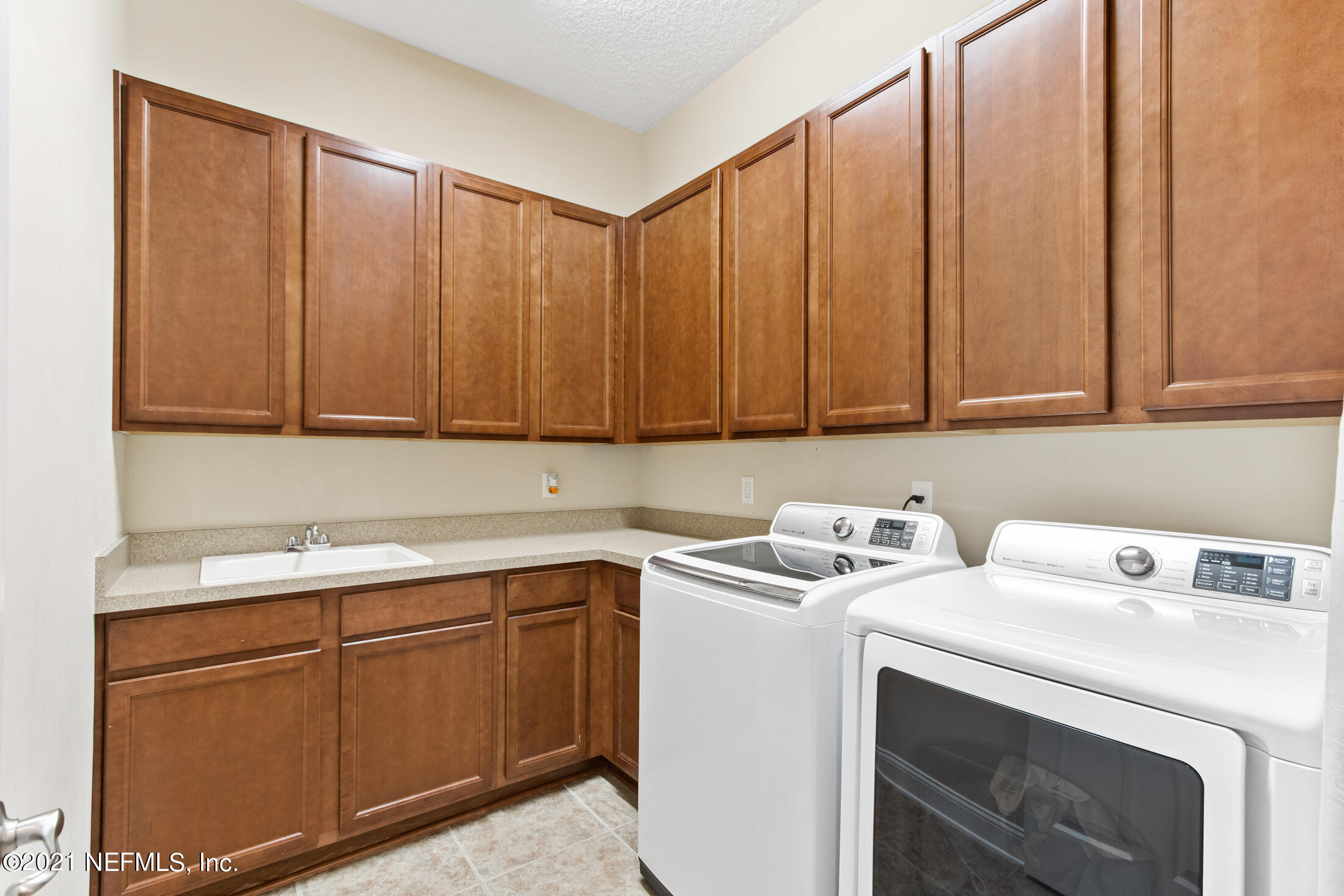 198 Glen Laurel Drive St. Johns, FL 32259 - Photo 37 of 51 a utility room with dryer and washer