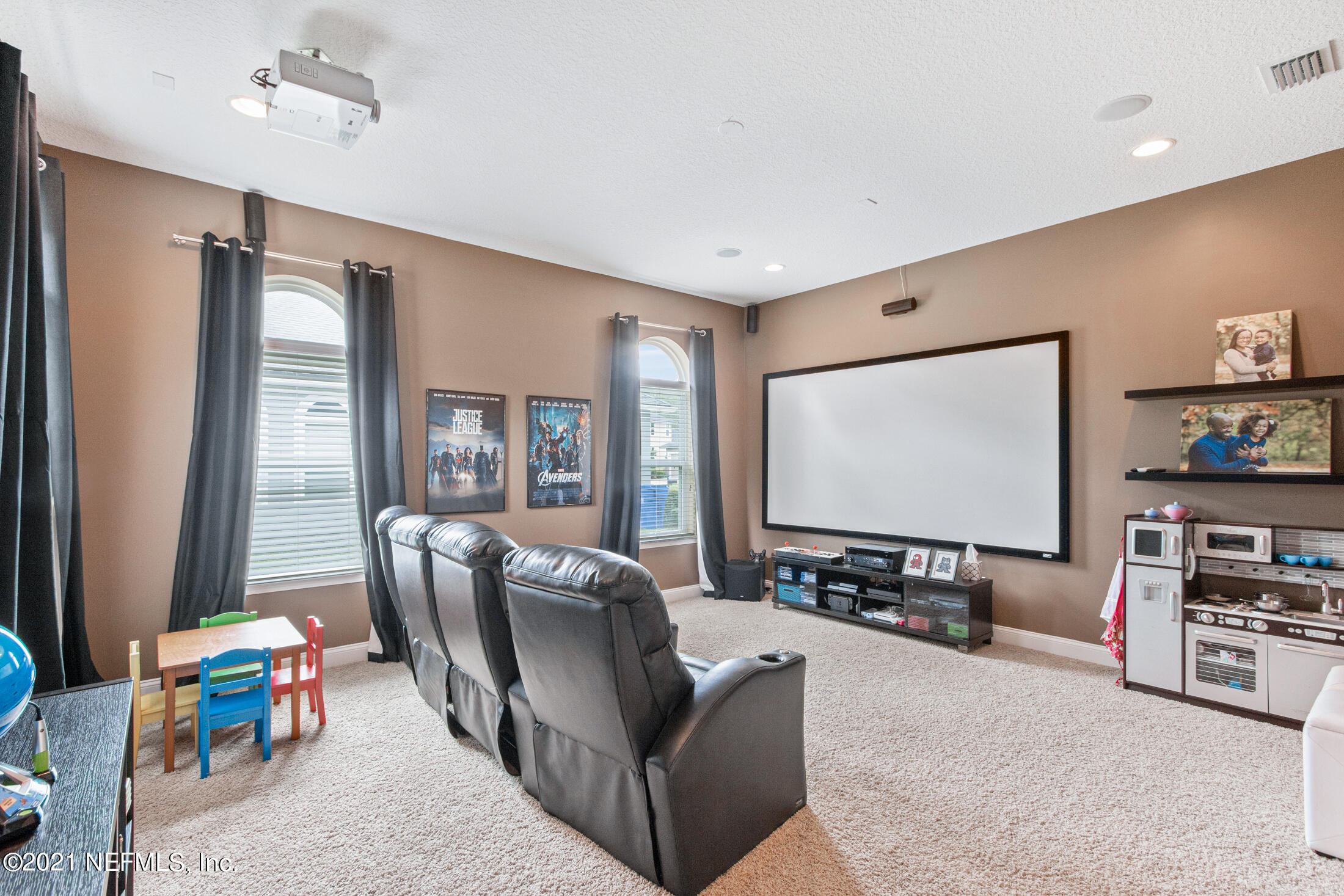 198 Glen Laurel Drive St. Johns, FL 32259 - Photo 39 of 51 a living room with furniture and a flat screen tv