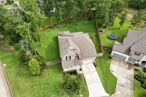 an aerial view of a house with pool