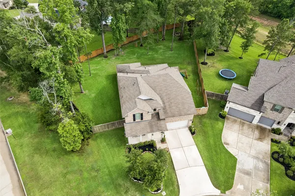 an aerial view of a house with pool