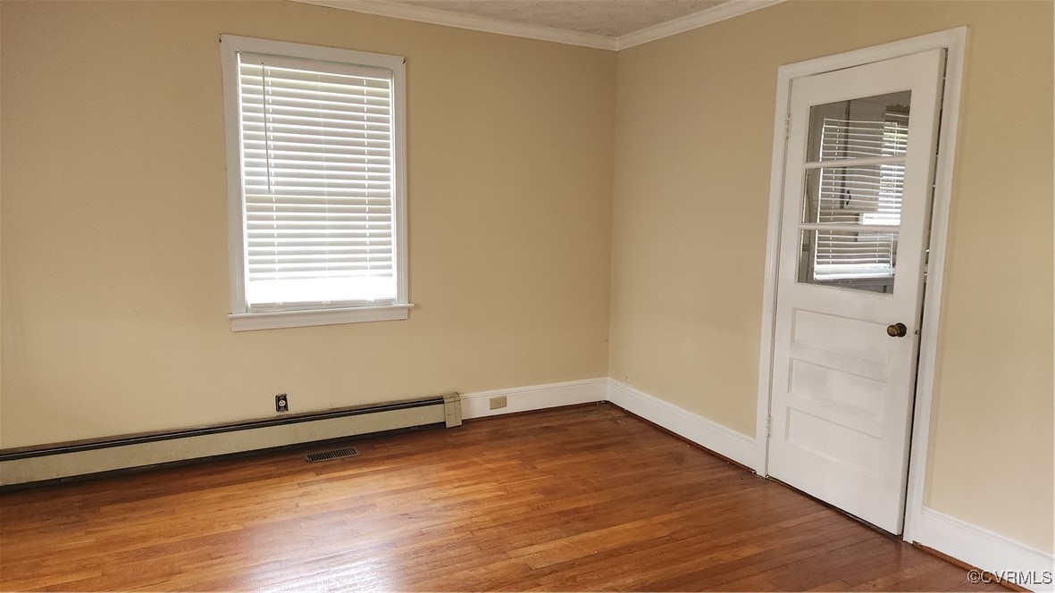 24816 Sawmill Road Carson, VA 23830 - Photo 14 of 24 an empty room with wooden floor and windows