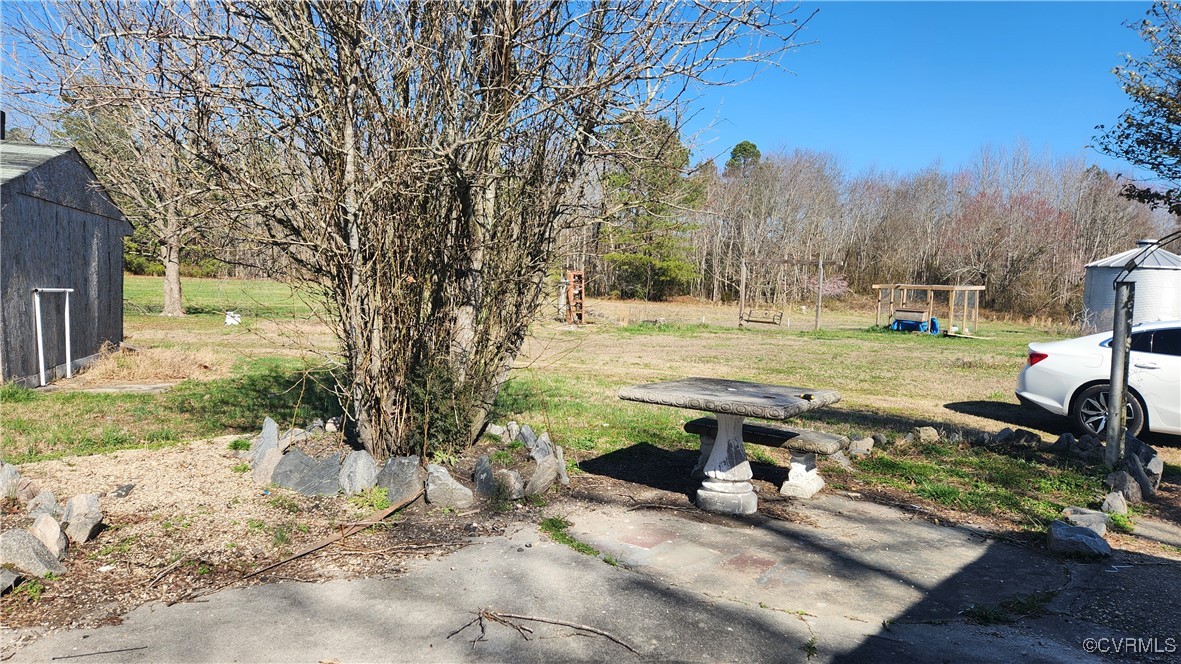 24816 Sawmill Road Carson, VA 23830 - Photo 3 of 24 a view of a yard with trees in the background