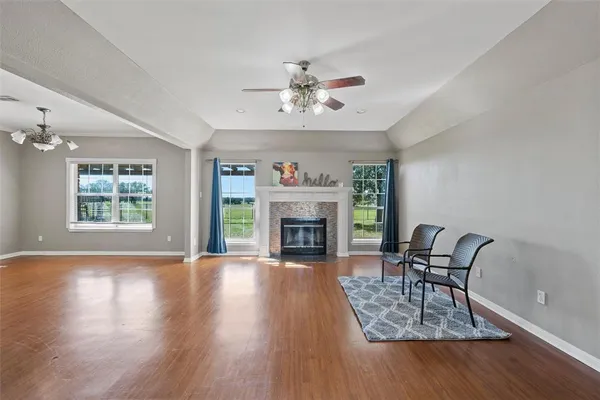 a view of a livingroom with furniture and wooden floor