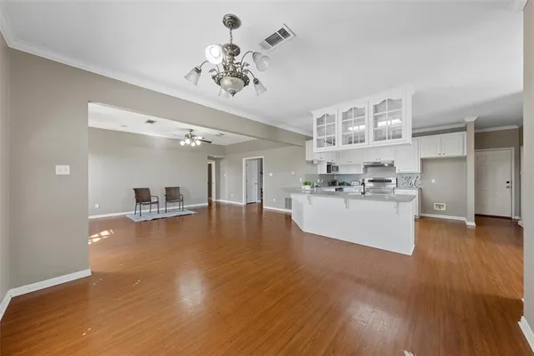 a view of living room with stainless steel appliances granite countertop furniture and kitchen view