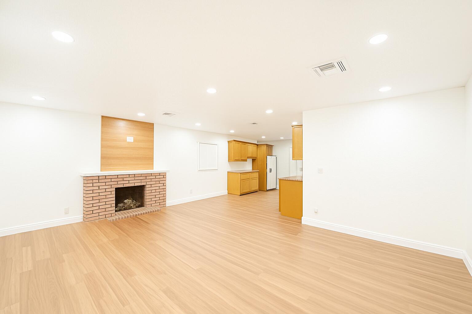 1027 Beech Road West Palm Beach, FL 33409 - Photo 5 of 13 a view of an empty room with a fireplace and a window