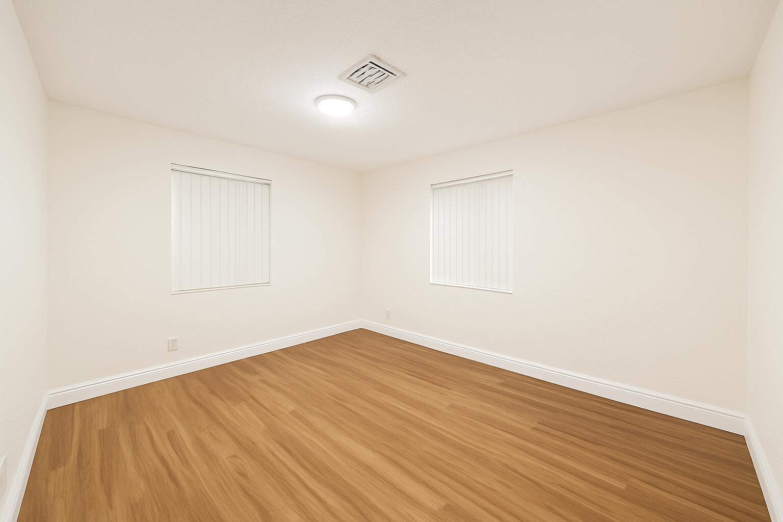 1027 Beech Road West Palm Beach, FL 33409 - Photo 8 of 13 an empty room with wooden floor and windows