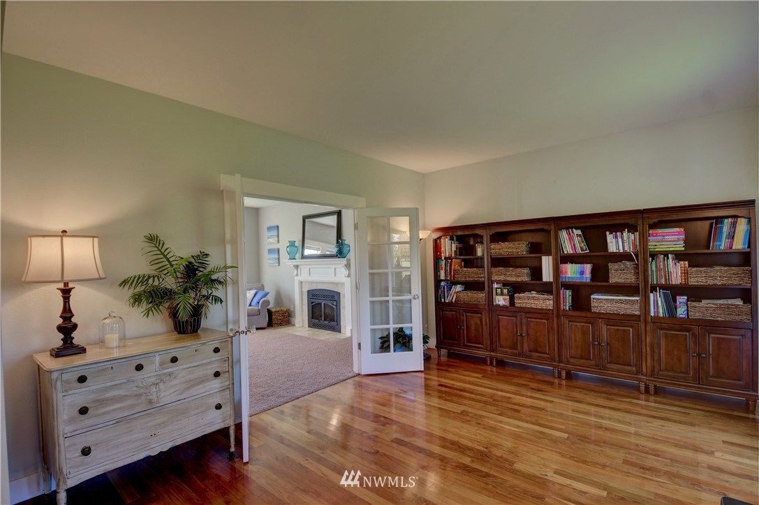 17012 Kaylen Lane Southwest Rochester, WA 98579 - Photo 2 of 26 a living room with furniture and a wooden floor