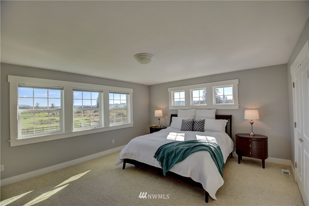 17012 Kaylen Lane Southwest Rochester, WA 98579 - Photo 11 of 26 a bedroom with a bed and window