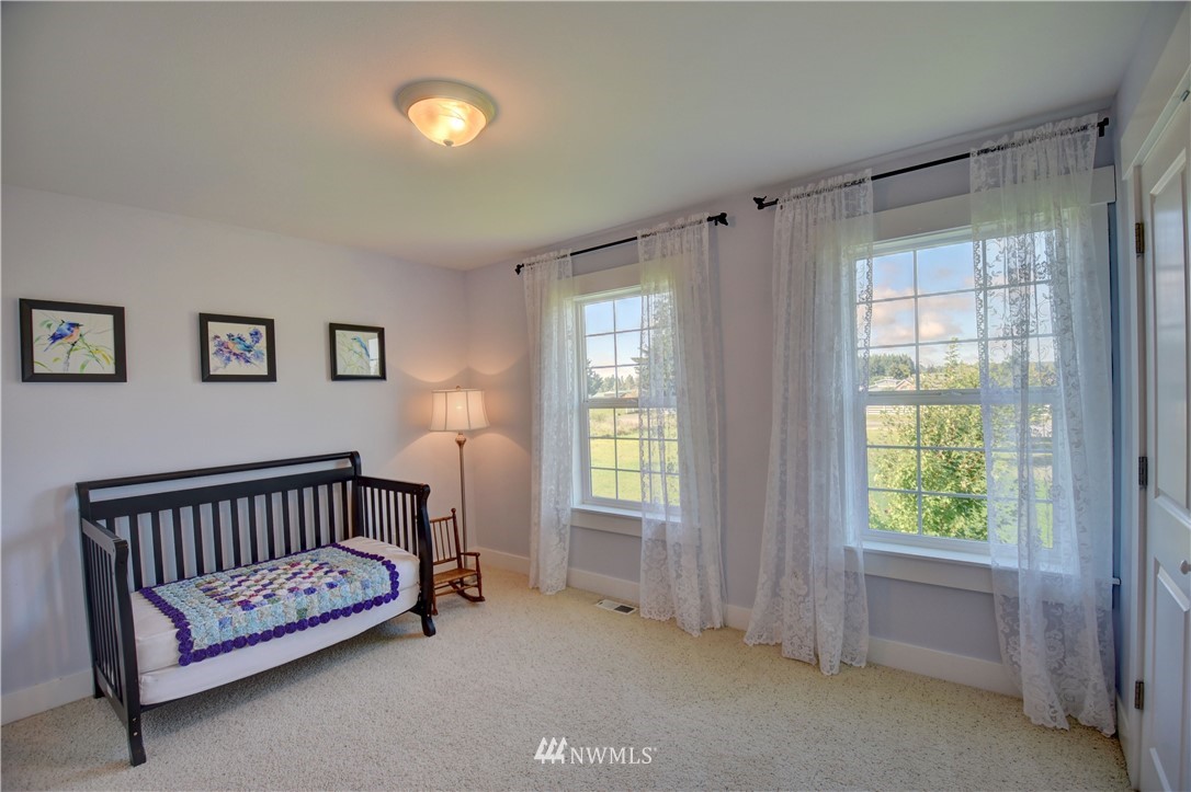17012 Kaylen Lane Southwest Rochester, WA 98579 - Photo 17 of 26 a bedroom with furniture and a window