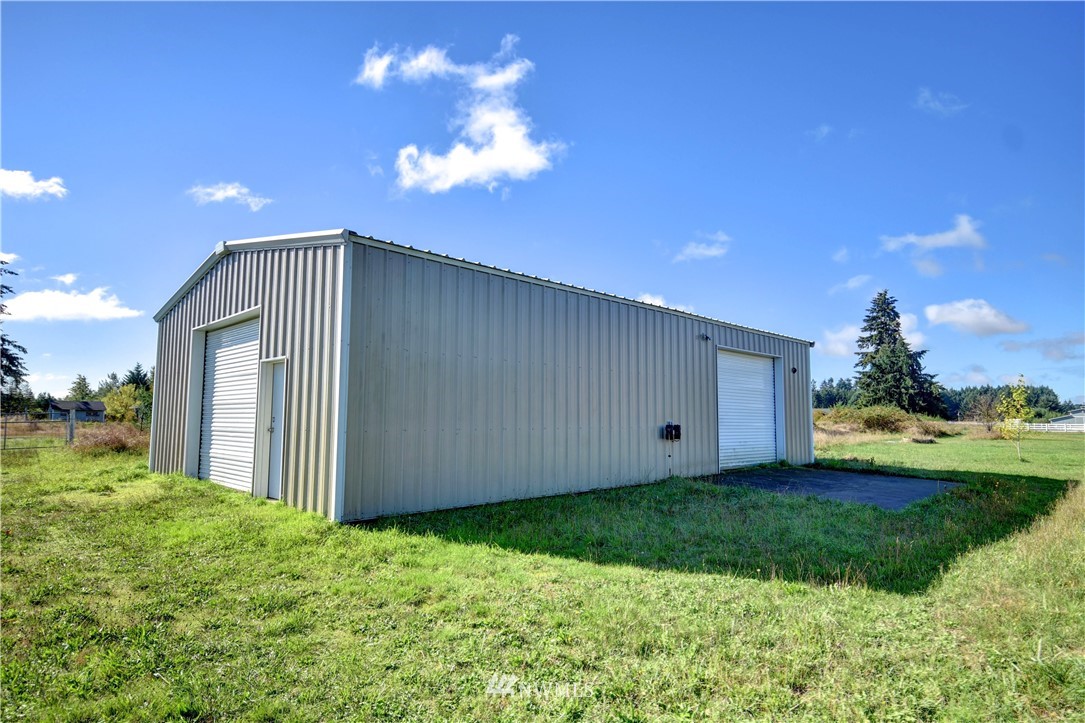 17012 Kaylen Lane Southwest Rochester, WA 98579 - Photo 19 of 26 a view of a house with backyard and garden