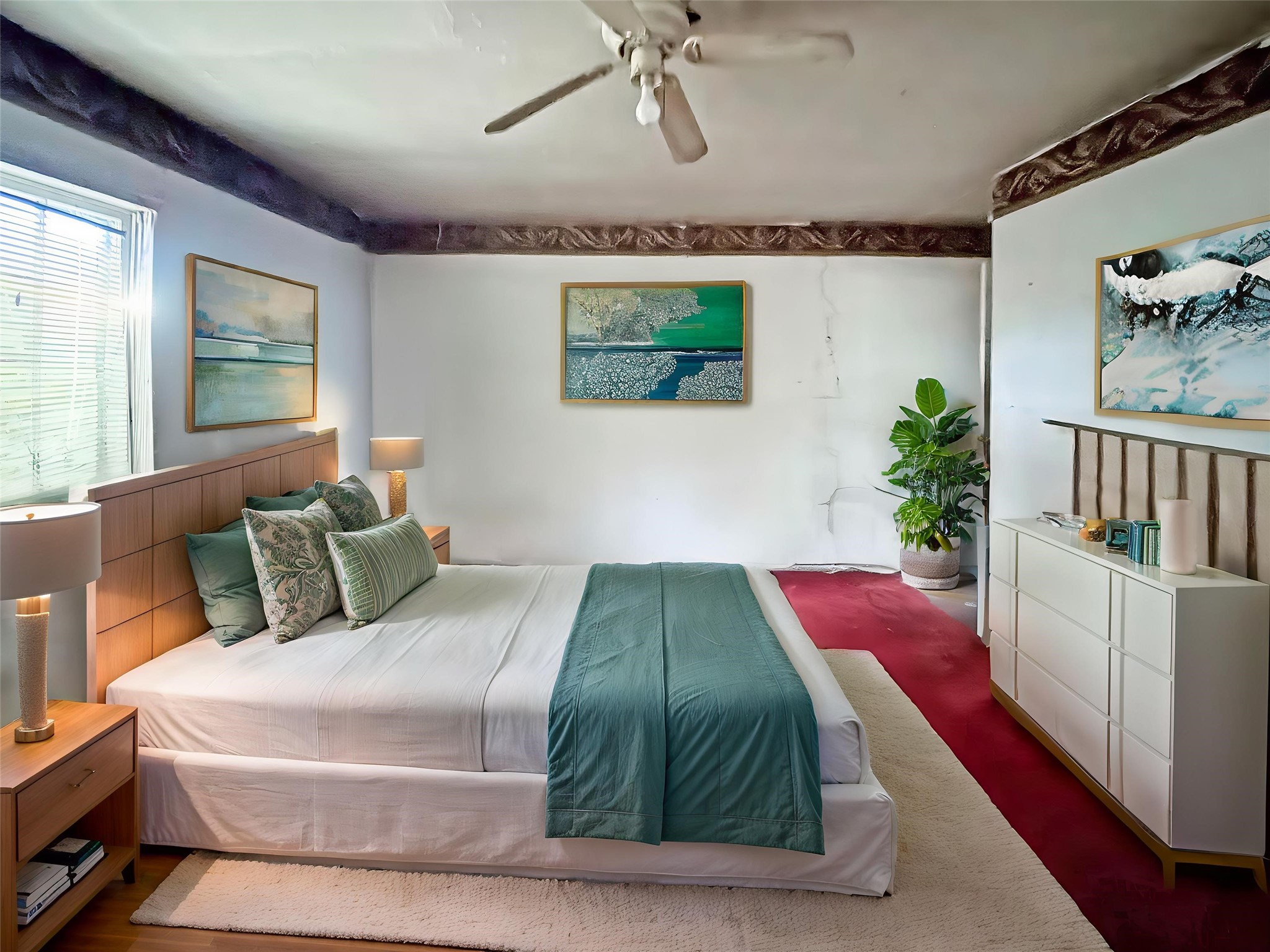 6723 London Street Houston, TX 77021 - Photo 3 of 14 a bedroom with a bed and a potted plant