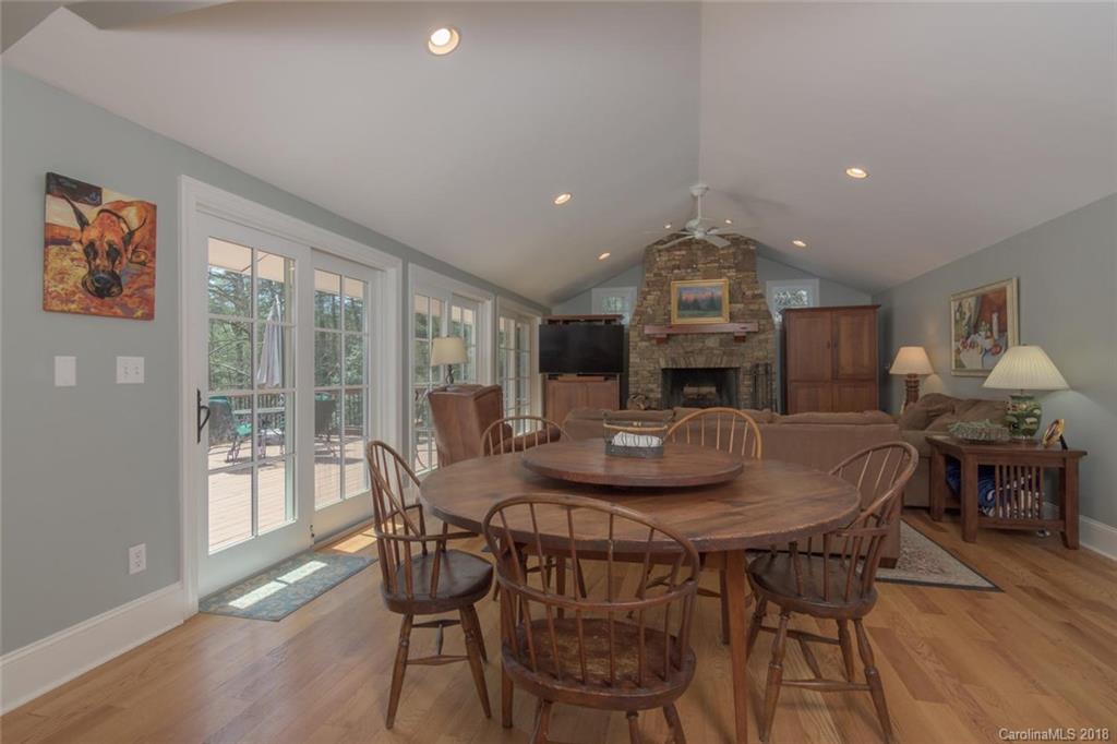 85 Forest Road Asheville, NC 28803 - Photo 12 of 39 a view of a dining room with furniture window and wooden floor