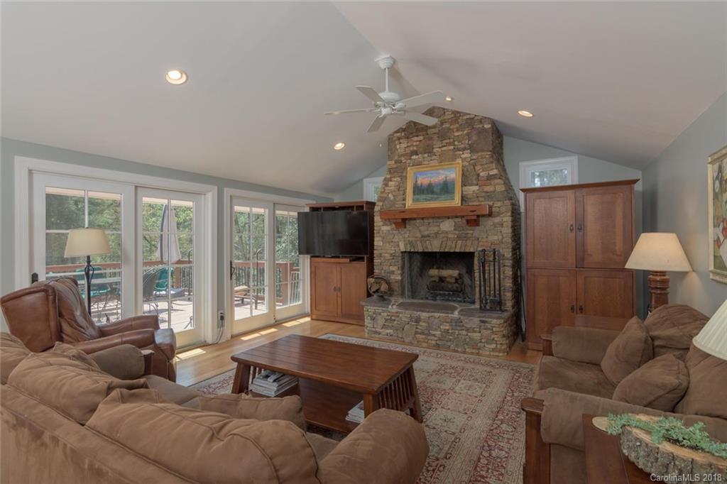 85 Forest Road Asheville, NC 28803 - Photo 13 of 39 a living room with furniture and a fireplace