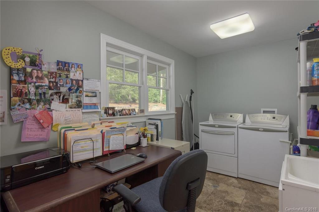 85 Forest Road Asheville, NC 28803 - Photo 15 of 39 a room with a workspace