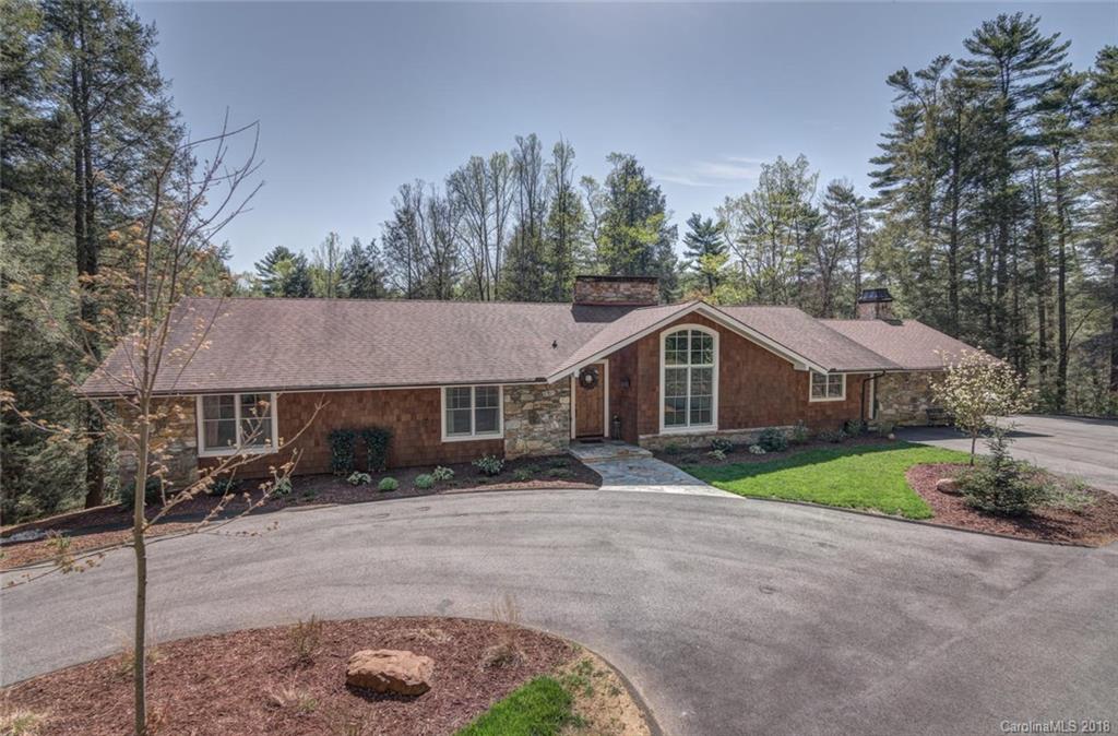 85 Forest Road Asheville, NC 28803 - Photo 3 of 39 a front view of a house with a yard and garage