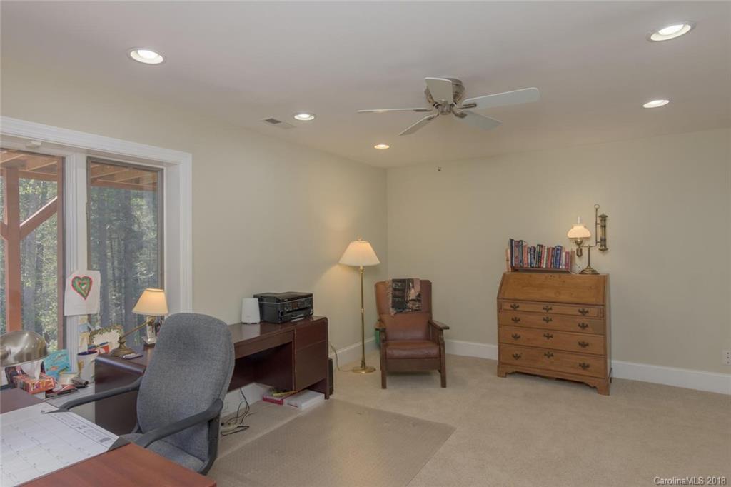 85 Forest Road Asheville, NC 28803 - Photo 24 of 39 a room with furniture and a lamp