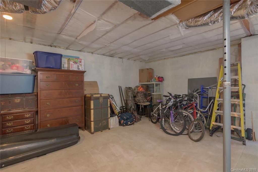 85 Forest Road Asheville, NC 28803 - Photo 27 of 39 a view of a storage room with two windows