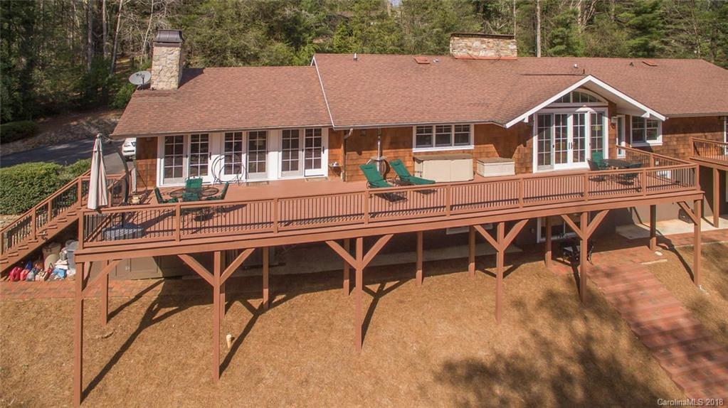 85 Forest Road Asheville, NC 28803 - Photo 29 of 39 a aerial view of a house with table and chairs