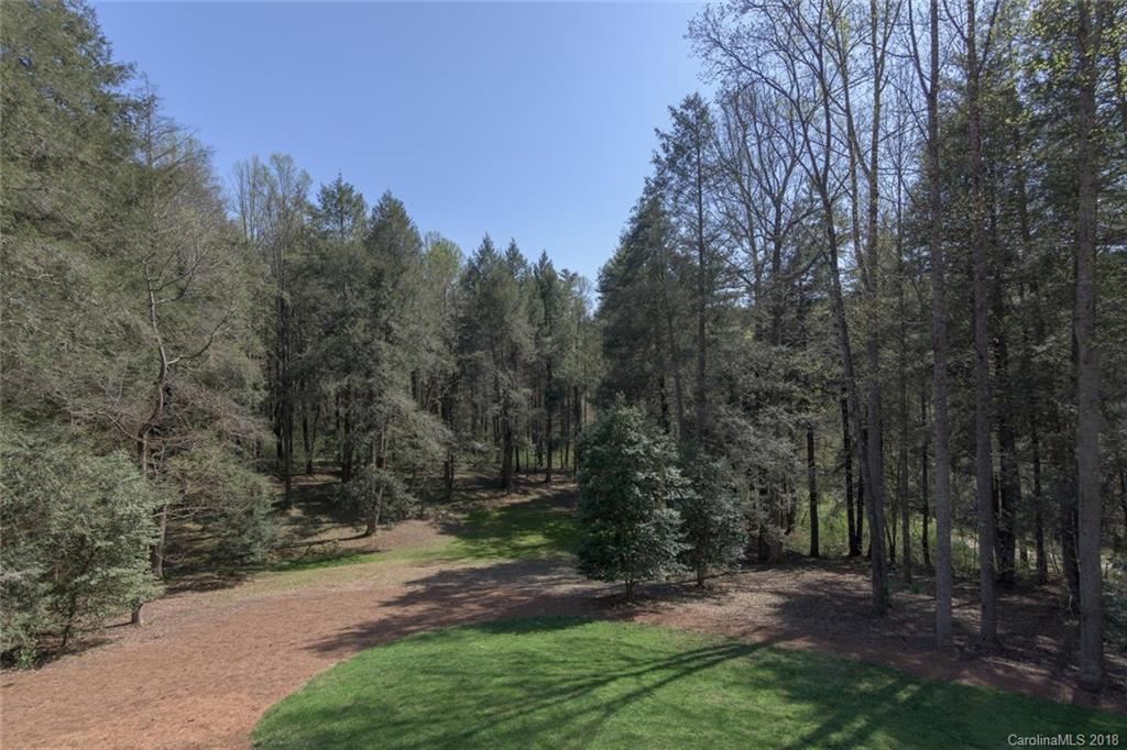 85 Forest Road Asheville, NC 28803 - Photo 30 of 39 a view of a backyard with trees