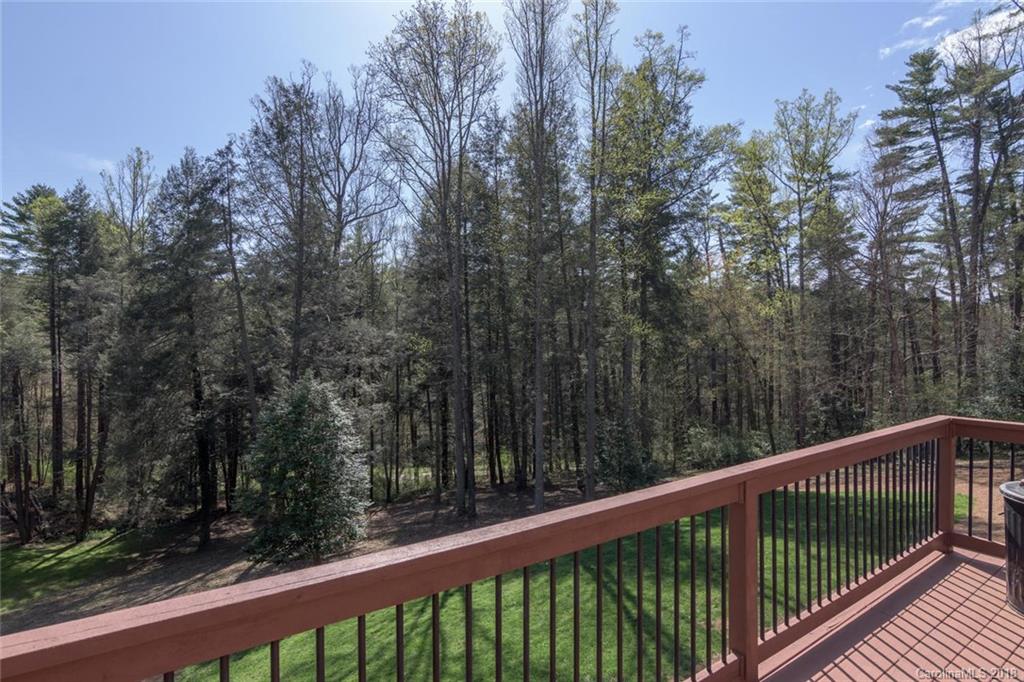 85 Forest Road Asheville, NC 28803 - Photo 32 of 39 a view of a balcony with trees