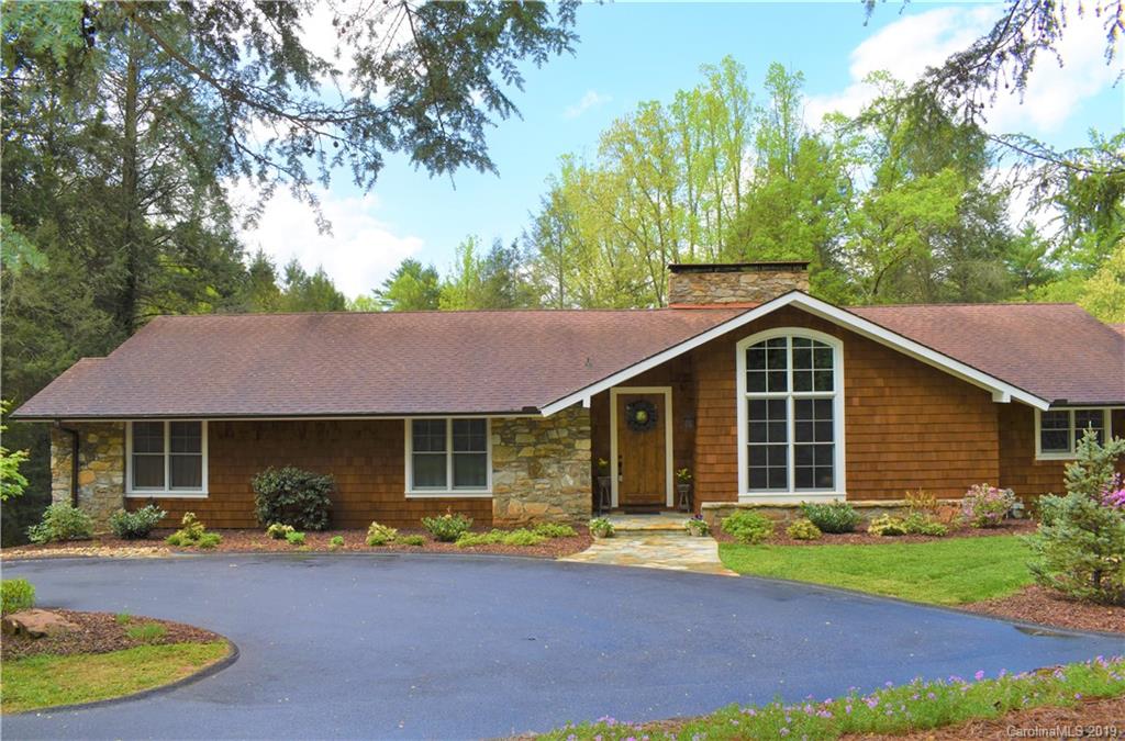 85 Forest Road Asheville, NC 28803 - Photo 39 of 39 a front view of a house with a garden and porch