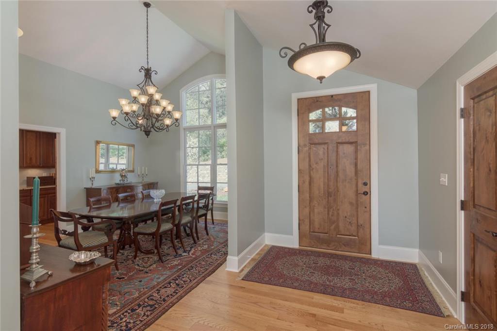 85 Forest Road Asheville, NC 28803 - Photo 5 of 39 a view of a dining room with furniture and chandelier