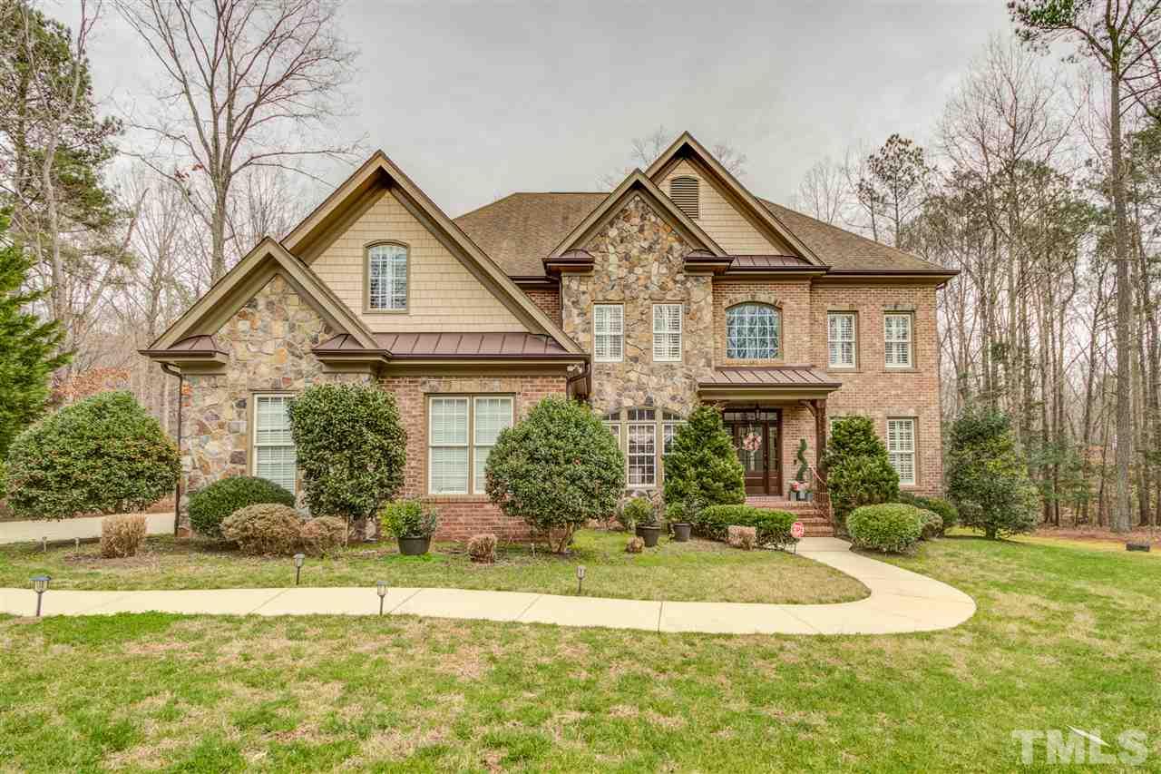 12228 Peed Road Raleigh, NC 27614 - Photo 1 of 30 a front view of a house with a yard