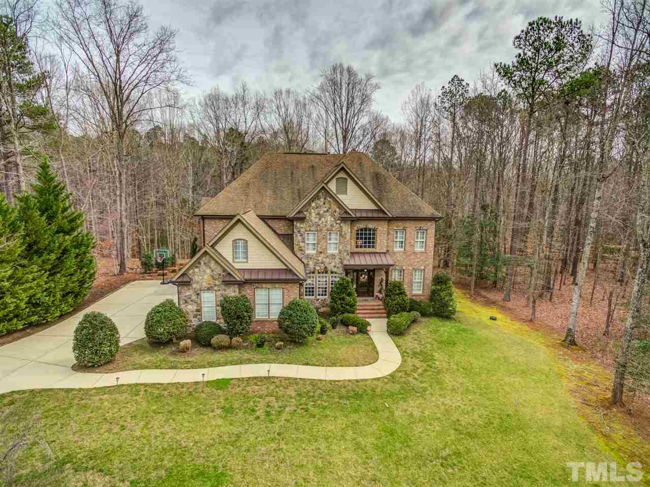 12228 Peed Road Raleigh, NC 27614 - Photo 2 of 30 a front view of a house with a yard and trees