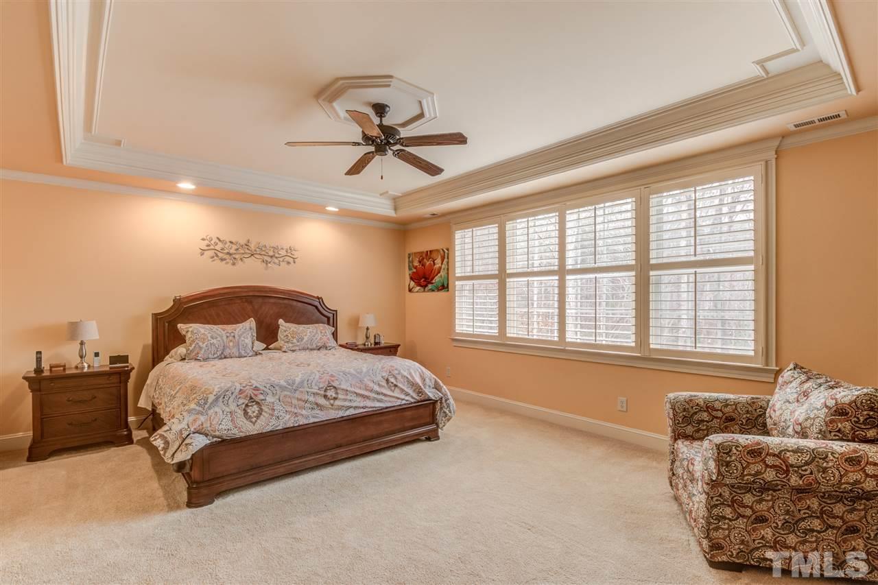 12228 Peed Road Raleigh, NC 27614 - Photo 13 of 30 a spacious bedroom with a bed couch and window