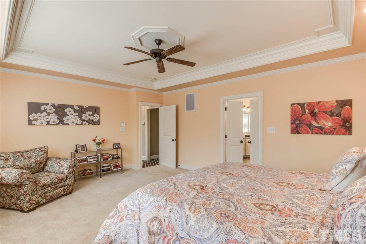 12228 Peed Road Raleigh, NC 27614 - Photo 14 of 30 a bed room with a bed and a couch