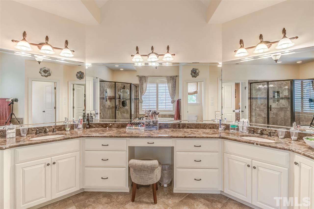 12228 Peed Road Raleigh, NC 27614 - Photo 16 of 30 a bathroom with a granite countertop sink and a mirror