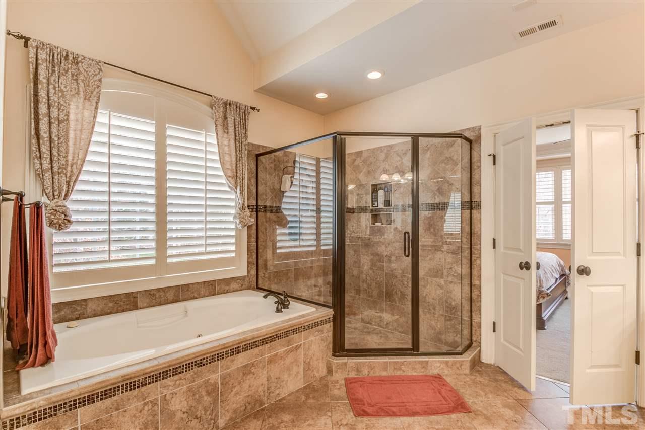 12228 Peed Road Raleigh, NC 27614 - Photo 17 of 30 a bathroom with a shower and a bathtub