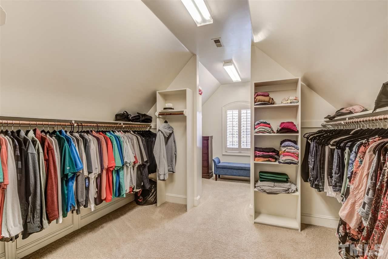 12228 Peed Road Raleigh, NC 27614 - Photo 18 of 30 a view of walk in closet with clothes and shoes