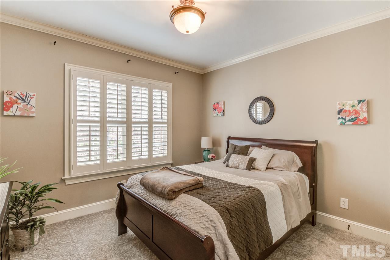 12228 Peed Road Raleigh, NC 27614 - Photo 19 of 30 a bedroom with a bed and a window