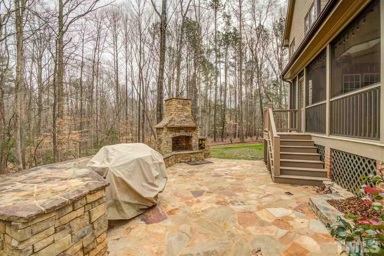 12228 Peed Road Raleigh, NC 27614 - Photo 30 of 30 a backyard of a house with table and chairs