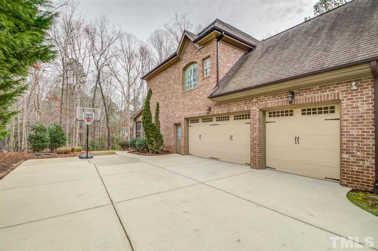 12228 Peed Road Raleigh, NC 27614 - Photo 4 of 30 a view of a house with a garage