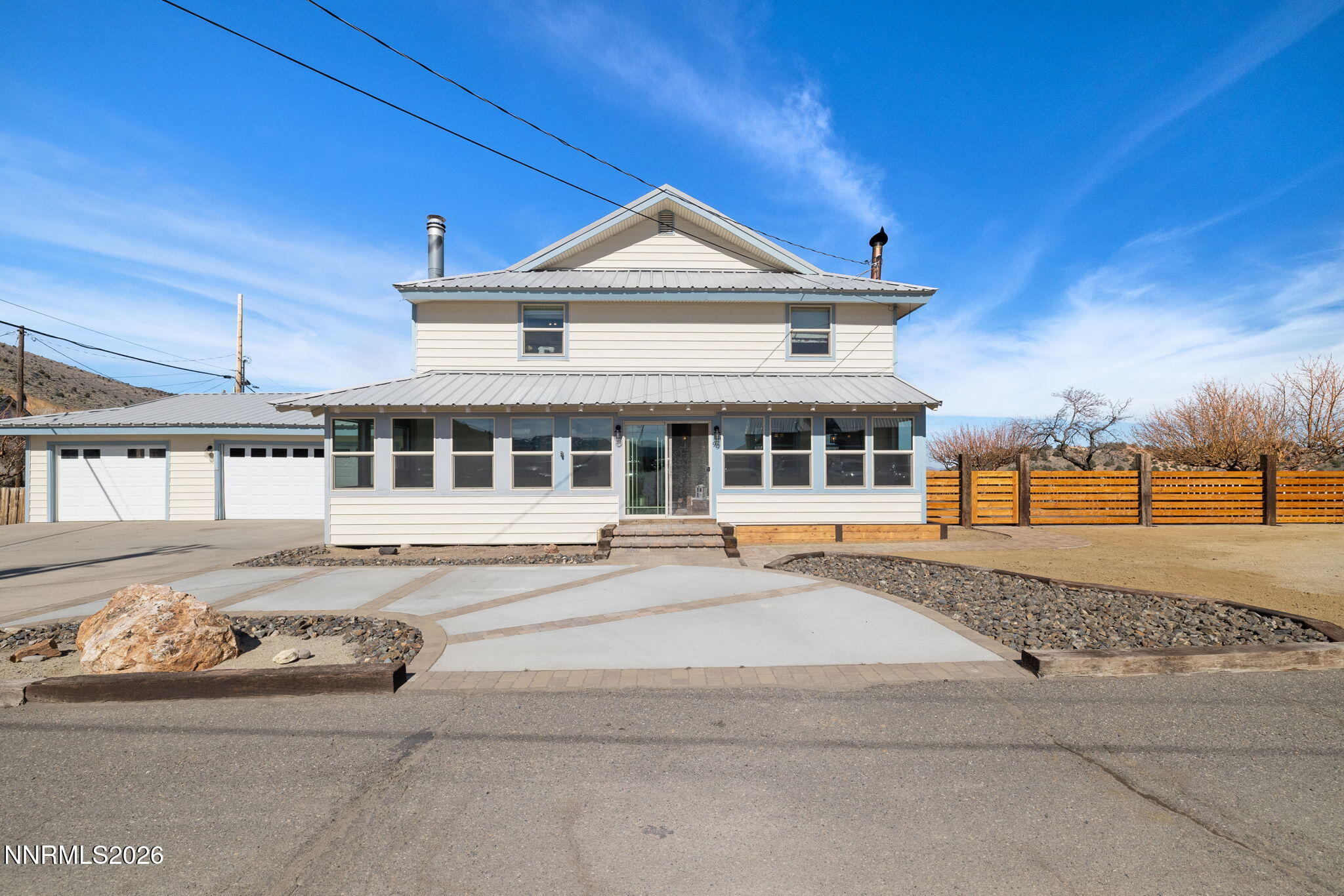 99 Toll Road Virginia City, NV 89440 - Photo 1 of 44 a front view of a house with a garden
