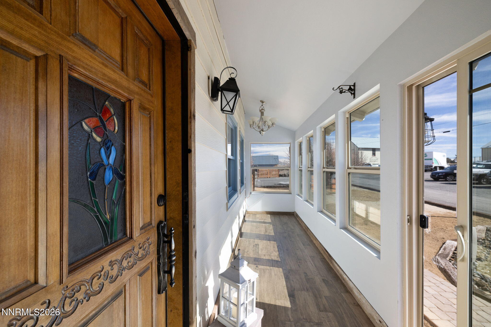 99 Toll Road Virginia City, NV 89440 - Photo 11 of 44 a view of a hallway with wooden floor and windows