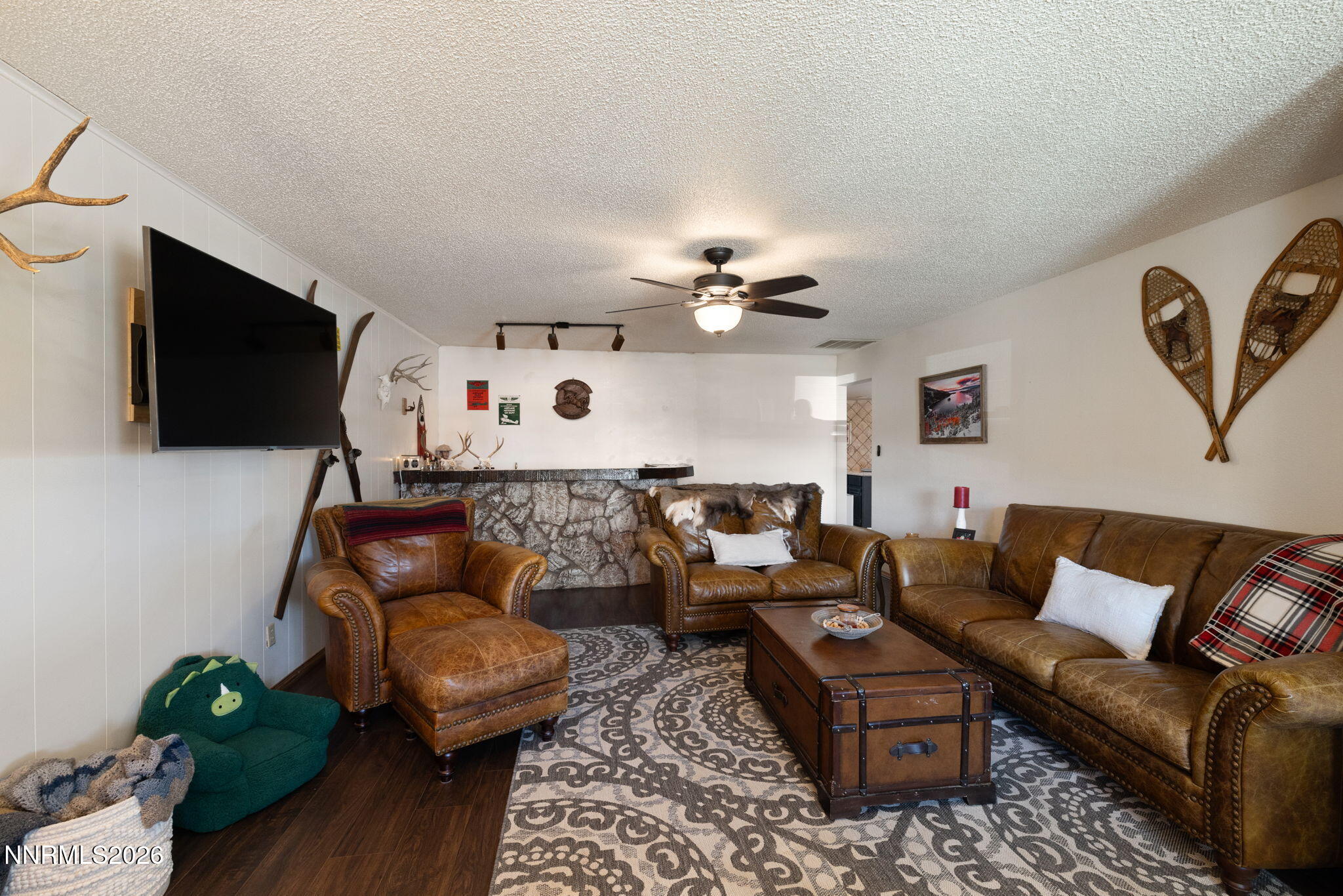 99 Toll Road Virginia City, NV 89440 - Photo 14 of 44 a living room with furniture and a flat screen tv